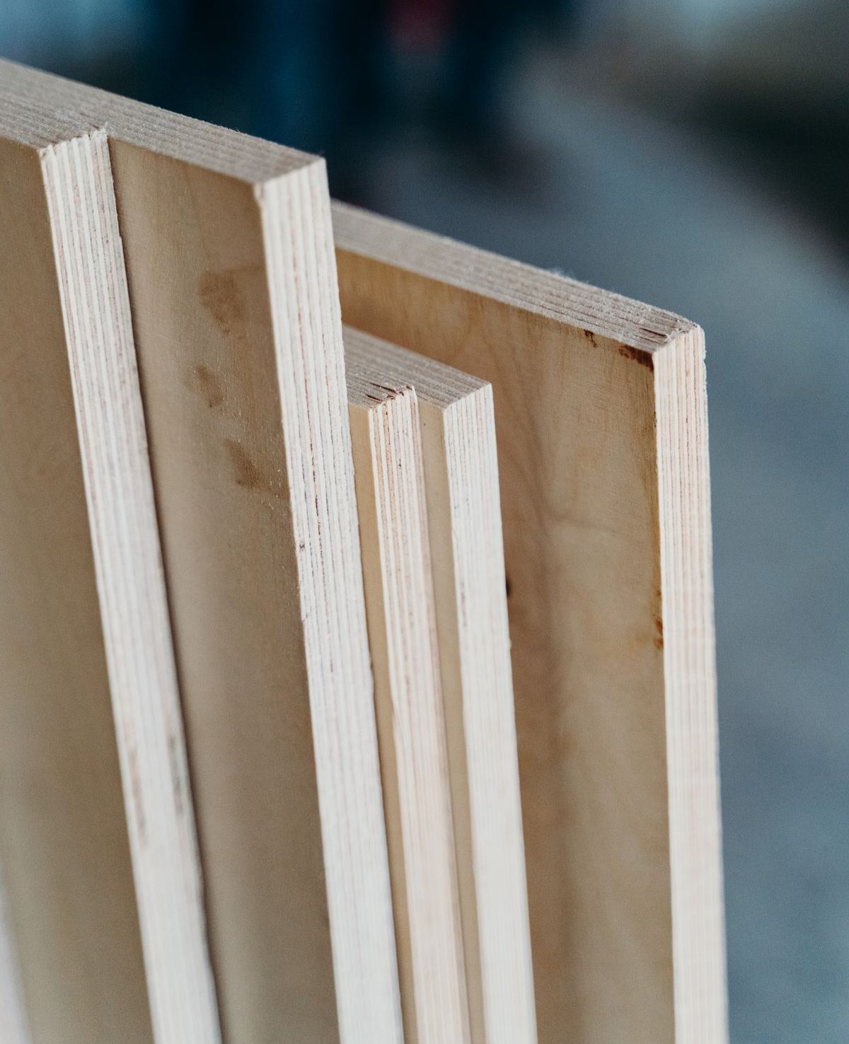 Flat wooden panels standing on edge, leaning together