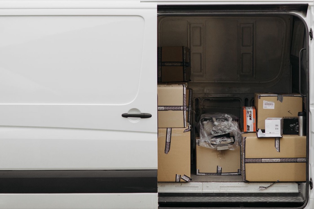 An open van with boxes on one side and empty floor on the other